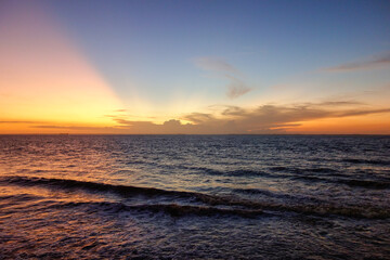 wonderful sunset with colors reflecting in the sky and the sea