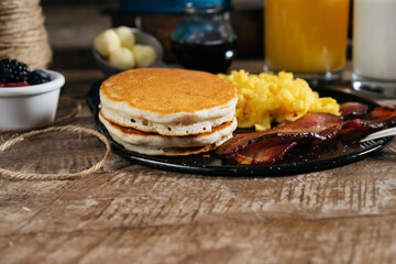 Pancake with eggs and bacon breakfast