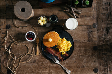 Pancake with eggs and bacon breakfast