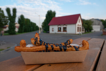 Churros, Italian donuts, choux pastry dessert, sweetness, chocolate sauce, close-up
