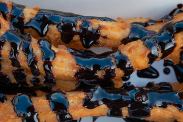 Churros, Italian donuts, choux pastry dessert, sweetness, chocolate sauce, close-up
