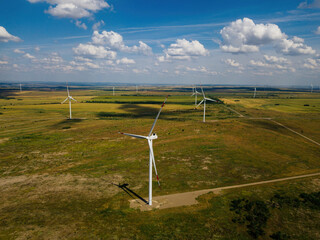 Wind turbines at the countryside in summer day, aerial view