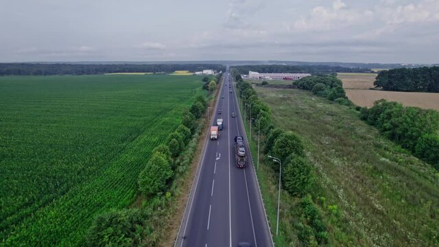 Car riding on the highway through the forest on countryside