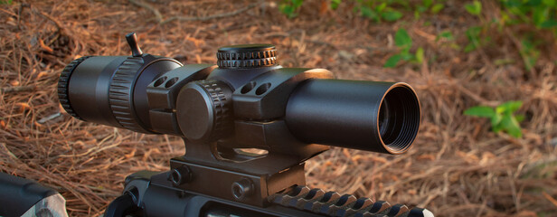 Rifle scope on a gun in the field