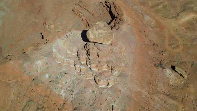 Cinematic aerial shot of Mexican Hat rock formation in Utah