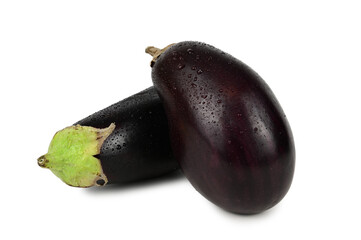 Two eggplants lying one on top of the other in water droplets isolated on a white background
