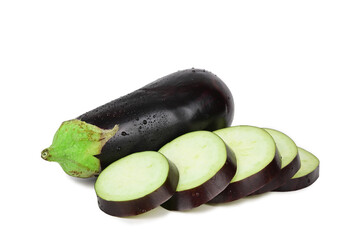 Ripe eggplant in water droplets next to another one, cut into circles, isolated on a white background