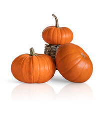 Composition with three orange pumpkins isolated on white background