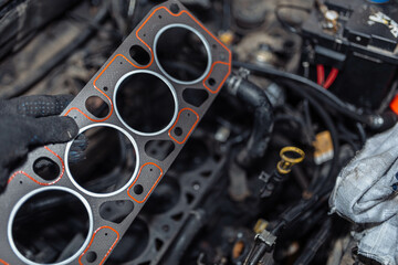 installing a new cylinder head gasket in the engine