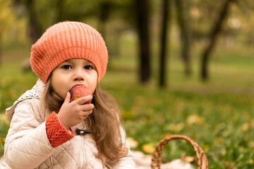 Close Up Portrait Of Little Cute Preschool Minor Girl In Orange Beret On Yellow Fallen Leaves Eats...