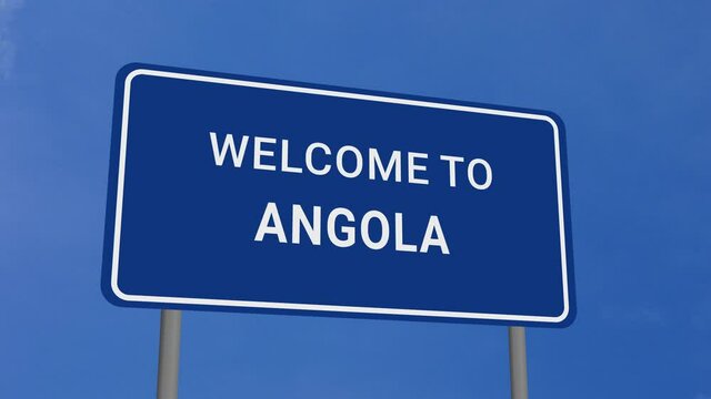 Welcome to Angola Road Sign on Clear Blue Sky with Rapid Moving Clouds