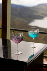 Cocktails on a black background table with landscape