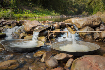 Obraz premium Large pans for boiling salt water in Mang River at Bo Kluea,Nan Province,northern Thailand.