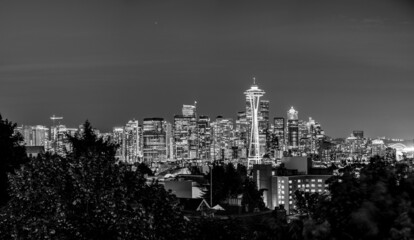 View of the Seattle Space Needle at night with Buildings in the background