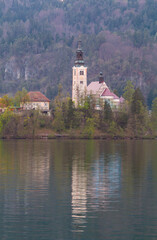 Fototapeta na wymiar Lake Bled in the middle of the island with the church at sunset in the Triglav National Park, Julian Alps