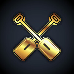 Gold Paddle icon isolated on black background. Paddle boat oars. Vector