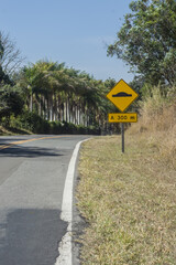 300 meter spine, written on a sign that is on a road, copy space on the left