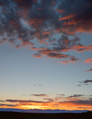 Southwest Sunset over Distant Mountains with Dark Orange Clouds
