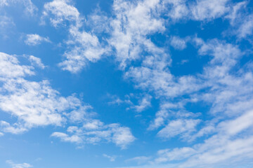 Fototapeta na wymiar Small clouds in a blue sky on the Oregon coast.