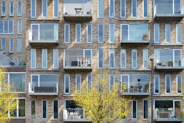 Facade of a modern residential building with balconies - obrazy, fototapety, plakaty