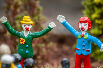 Closeup photo of tiny model clowns in costume