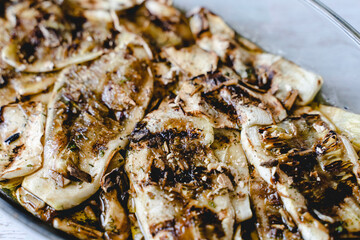 Close up grilled zucchini with garlic sauce homemade organic food in glass bowl