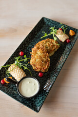 Potato pancakes with fried squid. The main ingredient for potato pancakes is potatoes 