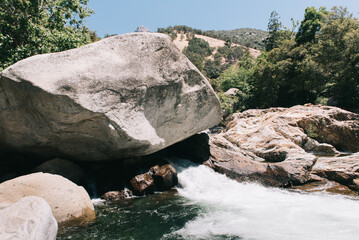 White river rocks along a raging river in Sequoia National Park.