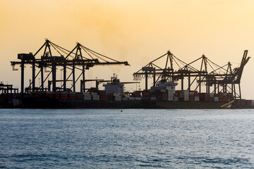 Fototapeta na wymiar Cranes and Vessels at international port of Cartagena de Indias