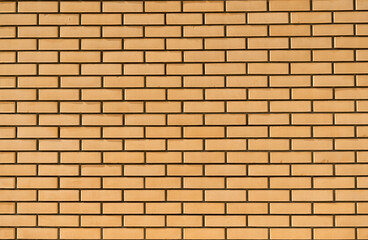 New brick wall background. Clean, neat, new brickwork surface