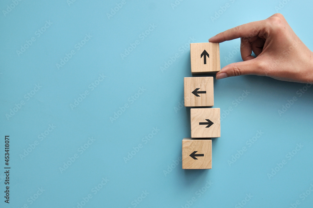 Poster there are many arrows pointing in different directions, and one arrow pointing up. a symbol of an in