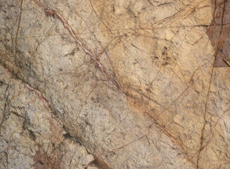 Natural pattern background of light brown stones.