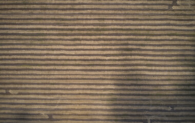 Shot of the field from drone. Farmers field. Road between fields. Background or texture
