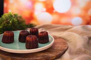Caneles de Bordeaux on a plate at Cristmas Time