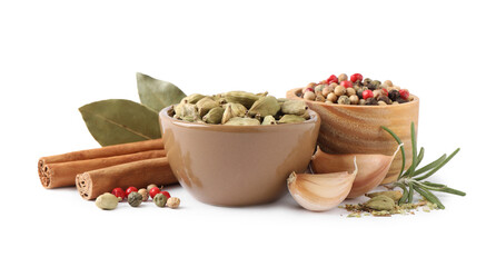 Different natural spices and herbs on white background