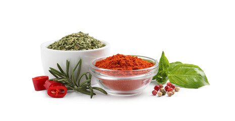 Different natural spices and herbs on white background