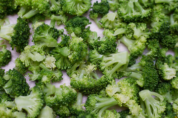 Cooked broccoli is lying on the table, filmed as a background of a vegetable