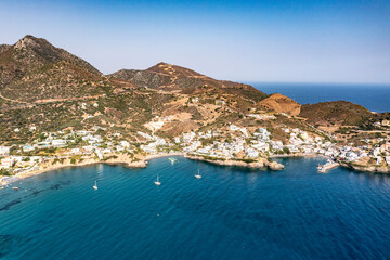 Obraz premium panoramic view of the sea and mountains and ships on turquoise water filmed from a drone