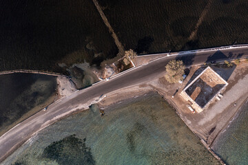 panoramic view of the old stone mills, bridge, road and sea filmed from a drone 