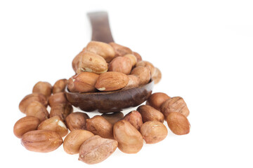 Peanut in wood spoon on white background.