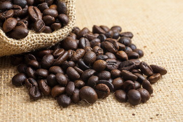 Fototapeta premium Coffee beans roasted in bag sack
