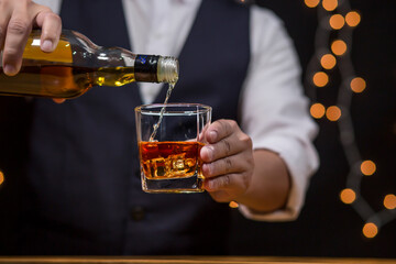 Bartender Serve Whiskey, on wood bar, 