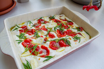 Homemade focaccia (mini pizza) with tomato and basil
