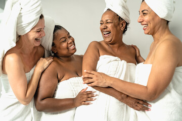 Happy multiracial women with different body size having skin care spa day - People wellness and...