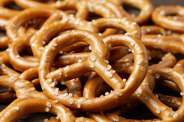 Pretzels on wooden background close up macro shot. Pretzels flat lay, top view