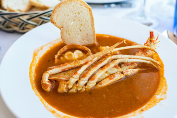 Lobster stew, a typical Menorcan dish.
Gastronomy, tourism, lobster stew with bread