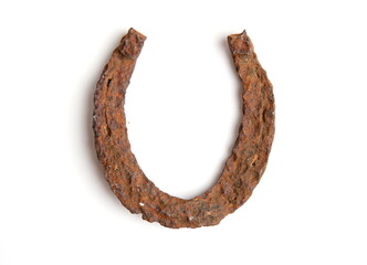 very old ancient rusty horse horseshoe isolated on white background