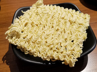 Instant noodles on black dish , Asian instant noodles 