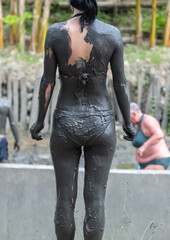 The woman in the healing mud.