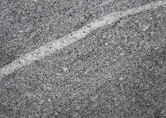 Abstract background. Fragment of a wall of marble close-up.